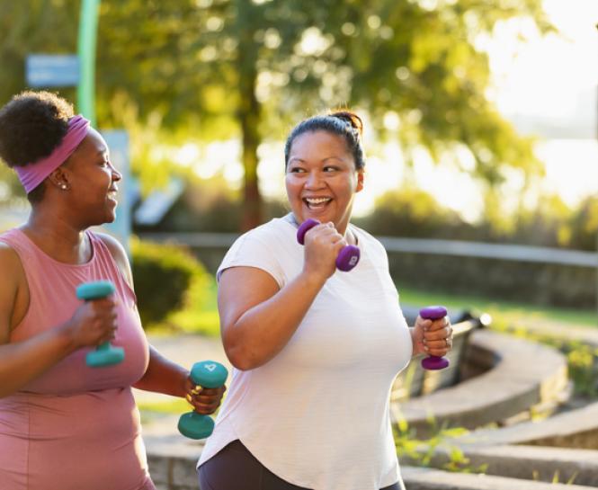 two women exercising outside