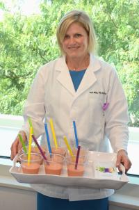 Beth Mille, Oncology Dietitian, holding tray of smoothies