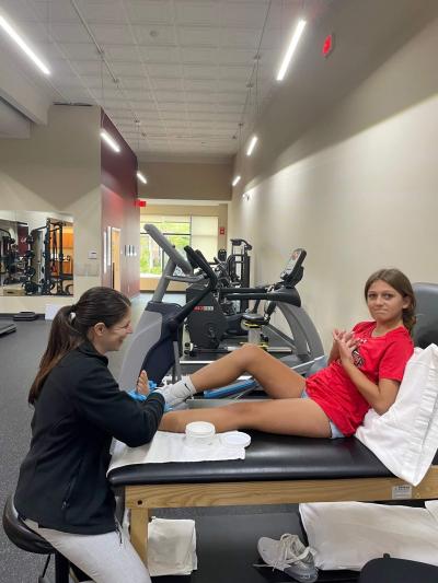 chloe downey with physical therapist