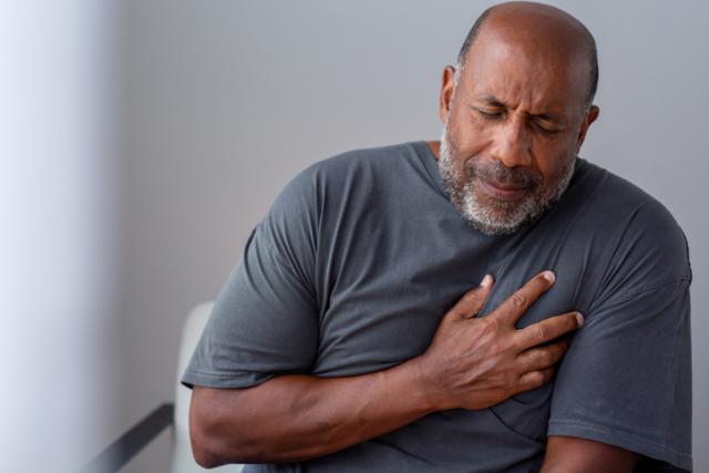 man experiencing chest discomfort
