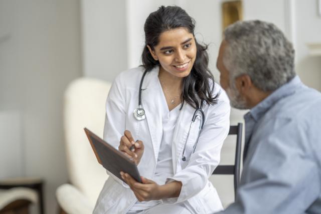 female doctor talking to male patient 