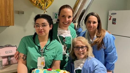 Good Samaritan hospital nurses celebrating with cake