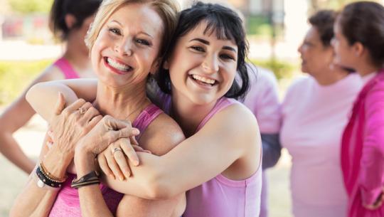young woman hugging older woman