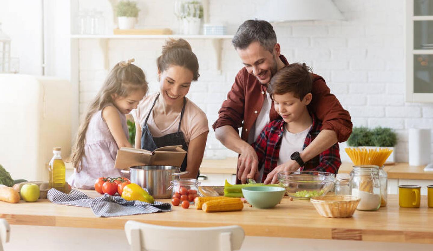 Family cooking and eating healthy