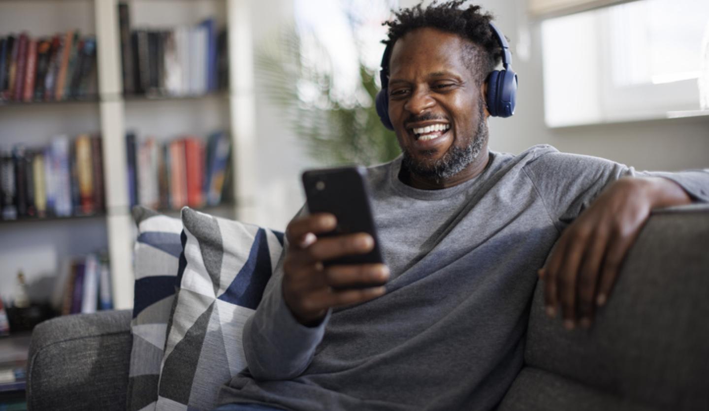 man listening to music with headphones