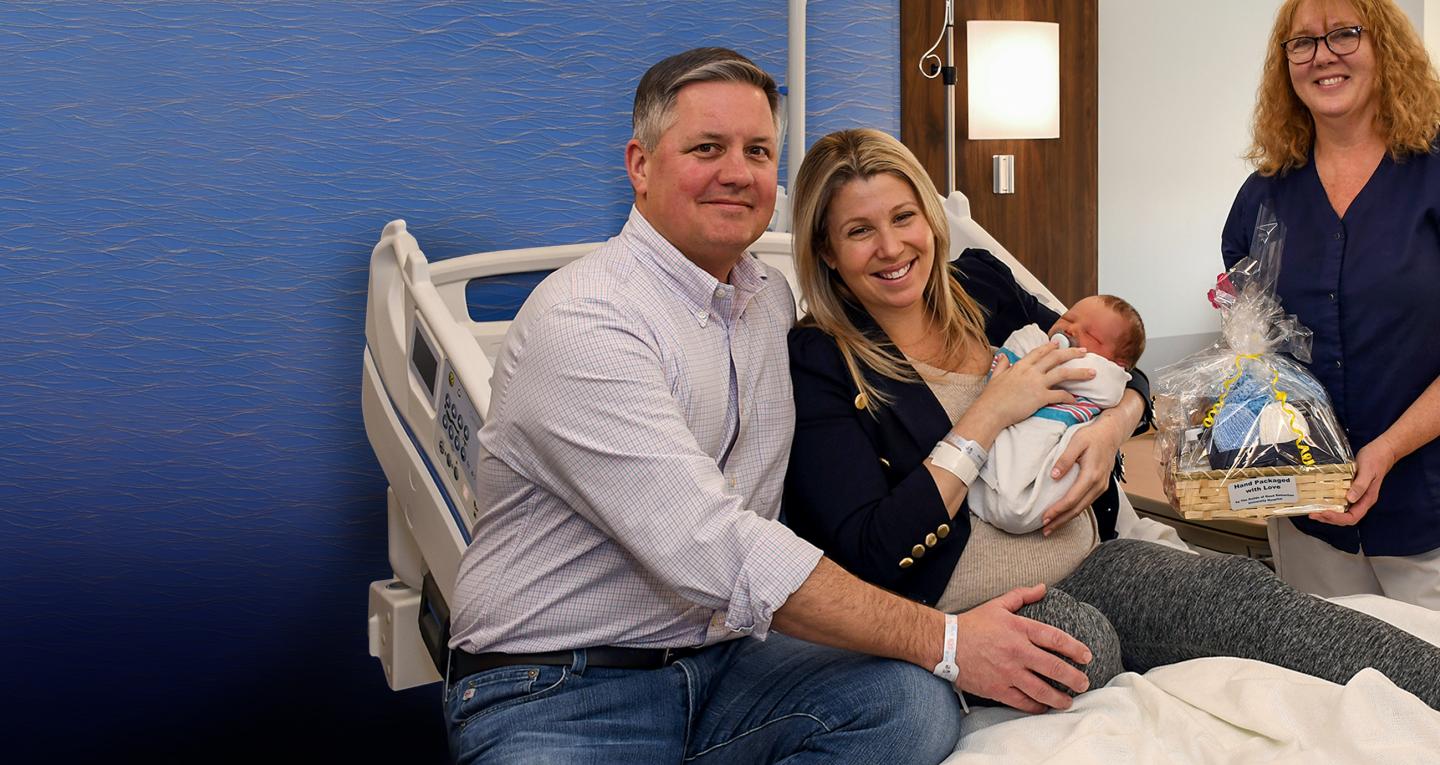 parents and nurse with baby