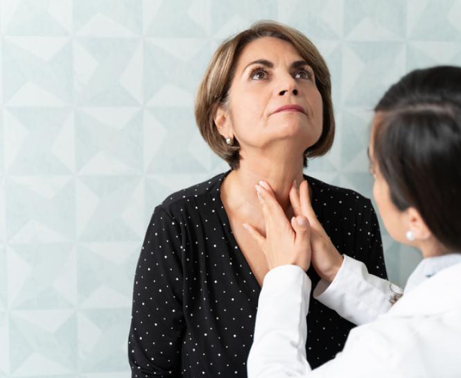 dr. checking thyroid