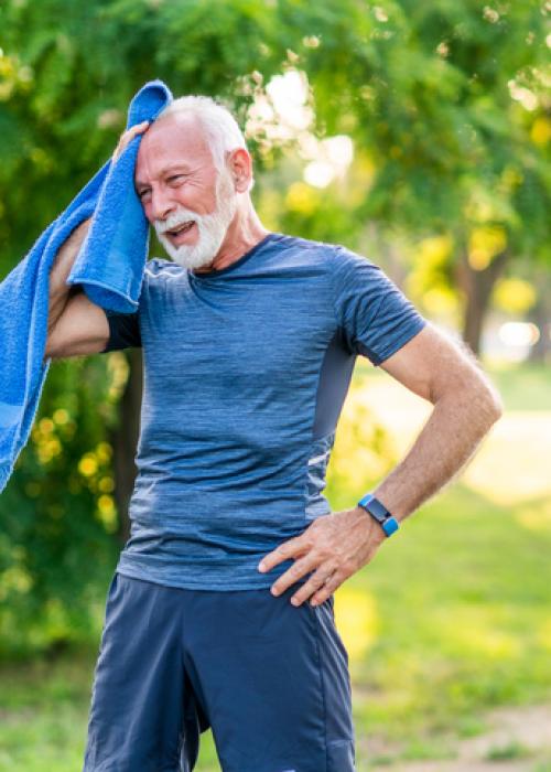 man cooling down with towel