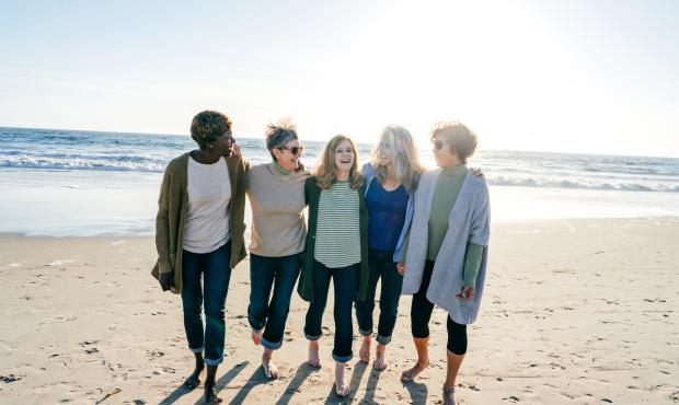 group of women walking on beach