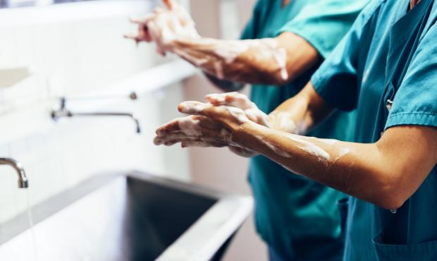 doctors scrubbing hands