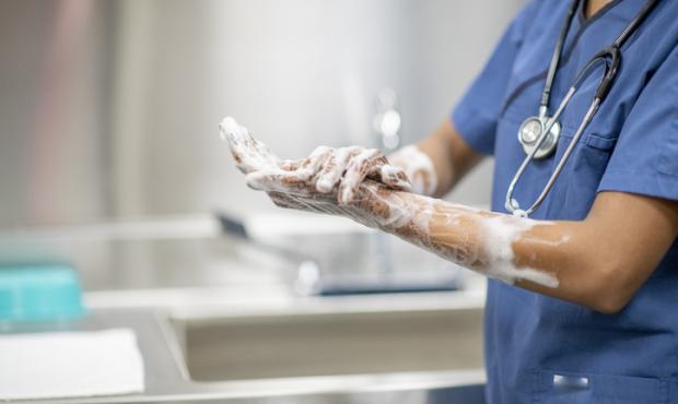 medical professional washing hands