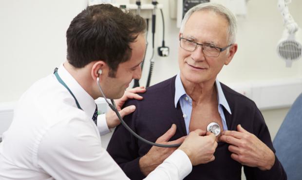 doctor listening to patient's heart