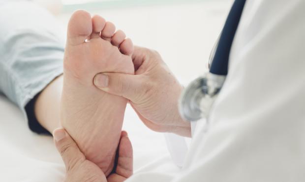 doctor examining patient's foot